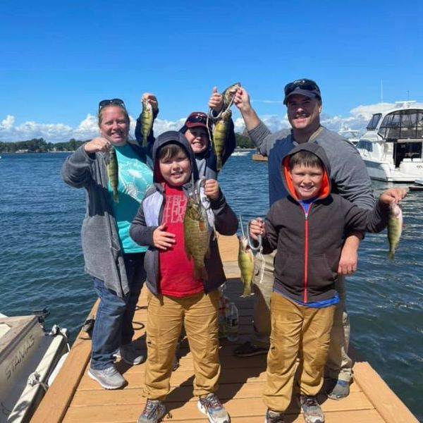 a family holding different fish Tours.jpg