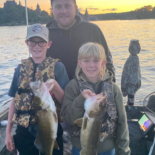 two kids holding bass they caught Home (2).jpg