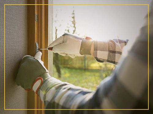 Handyman working on a window frame