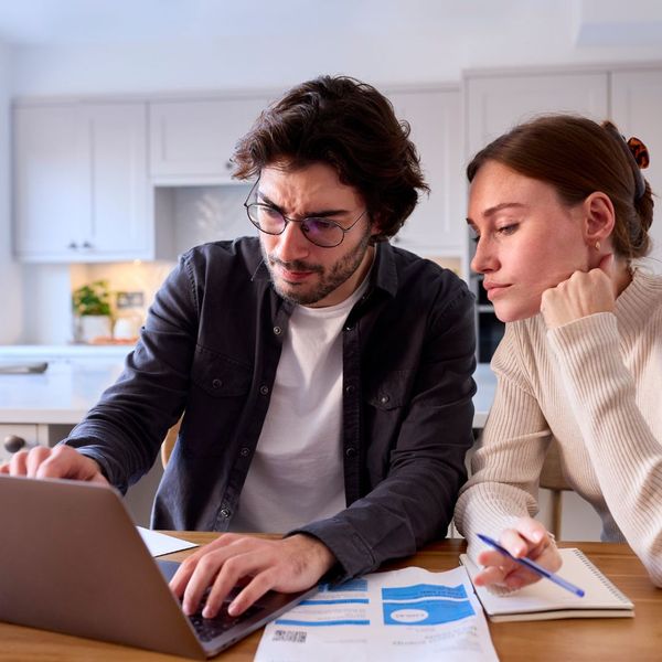 Couple looks at utility bills