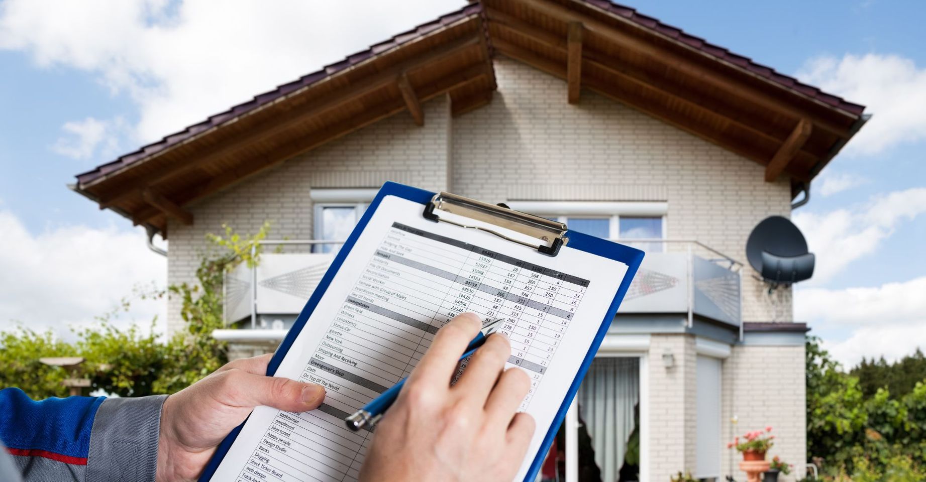 Inspection form in front of a home