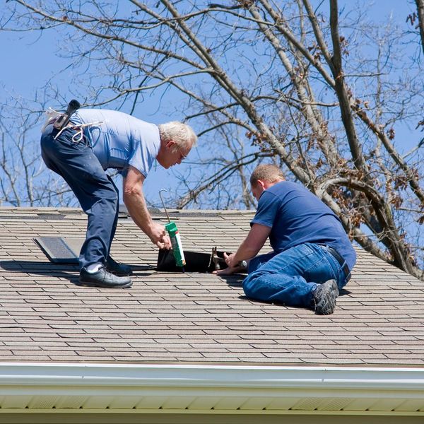 Men repair roof