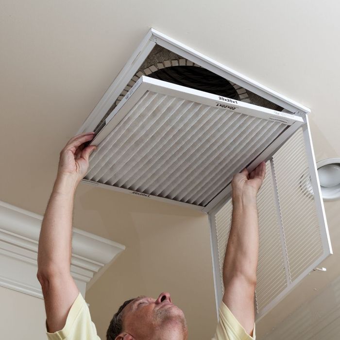 AC contractor replacing an air filter AC contractor replacing an air filter