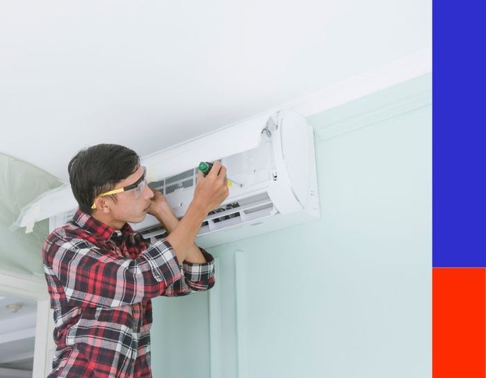 technician installing a mini split system technician installing a mini split system