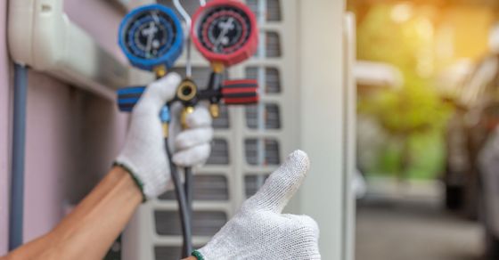 AC contractor checking an AC unit