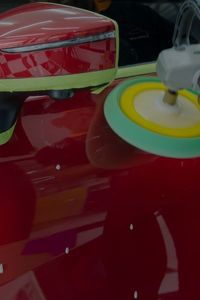 repairing exterior of red car