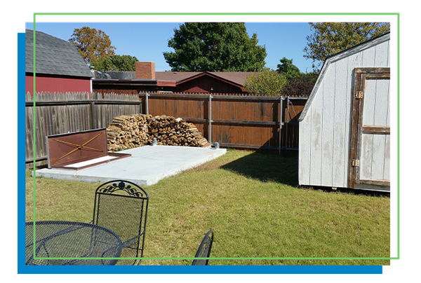 concrete storm shelter in a backyard