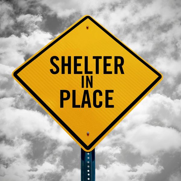 Sign that says "shelter in place."