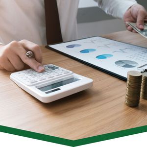 using calculator, counting stacks of coins/cash