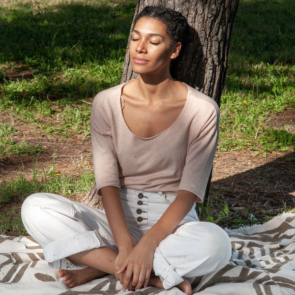 A woman outside in deep thought