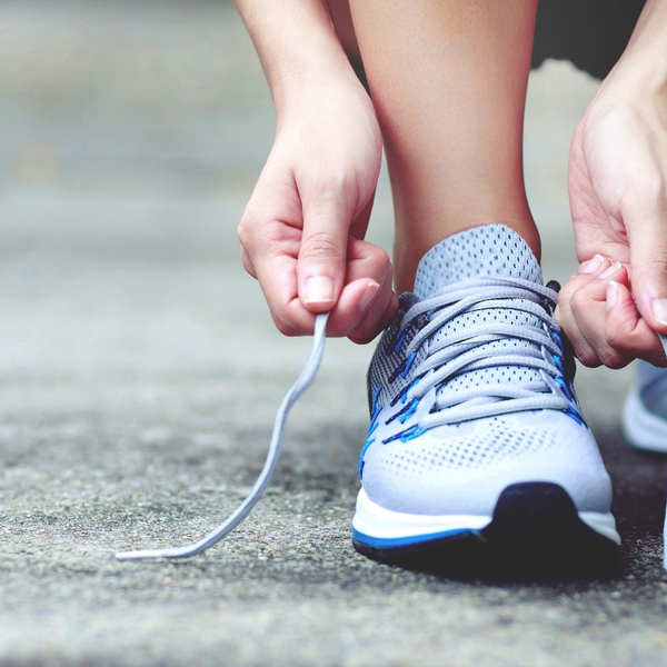 Person lacing up running shoes