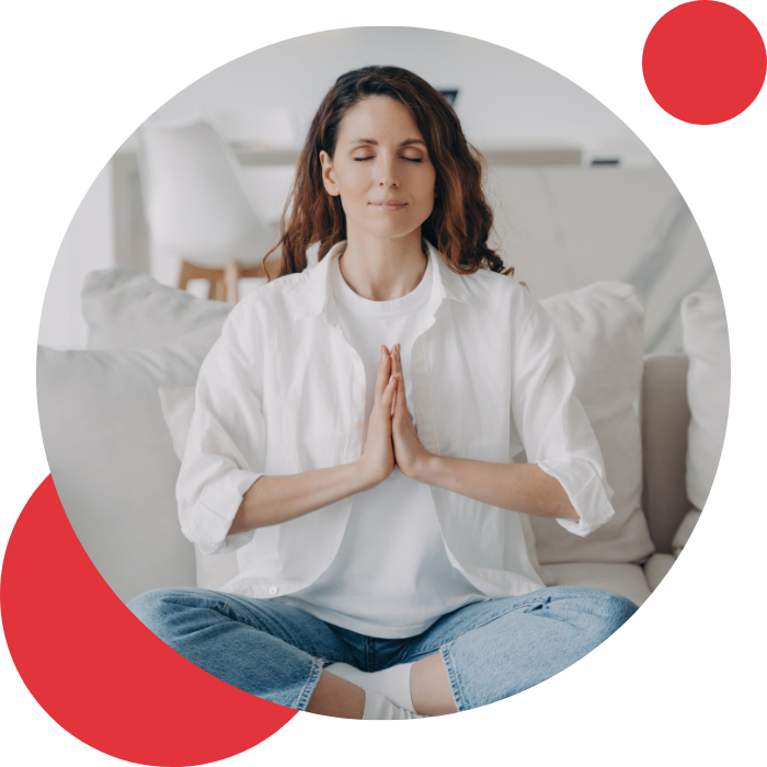 woman meditating in clean white airy room