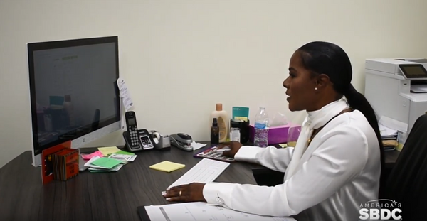 Image of a woman working in an office