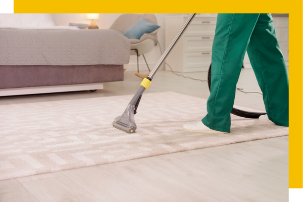 Vacuuming a bedroom