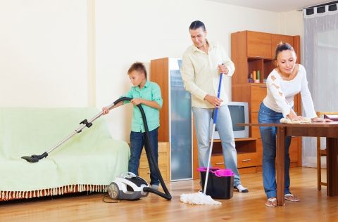 family cleaning the house