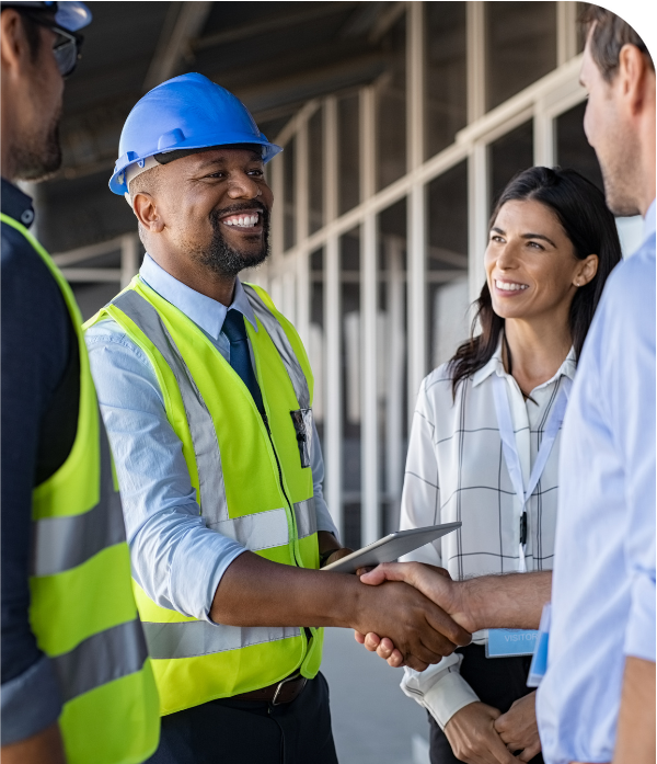 A roofing contractor shaking hands with a client