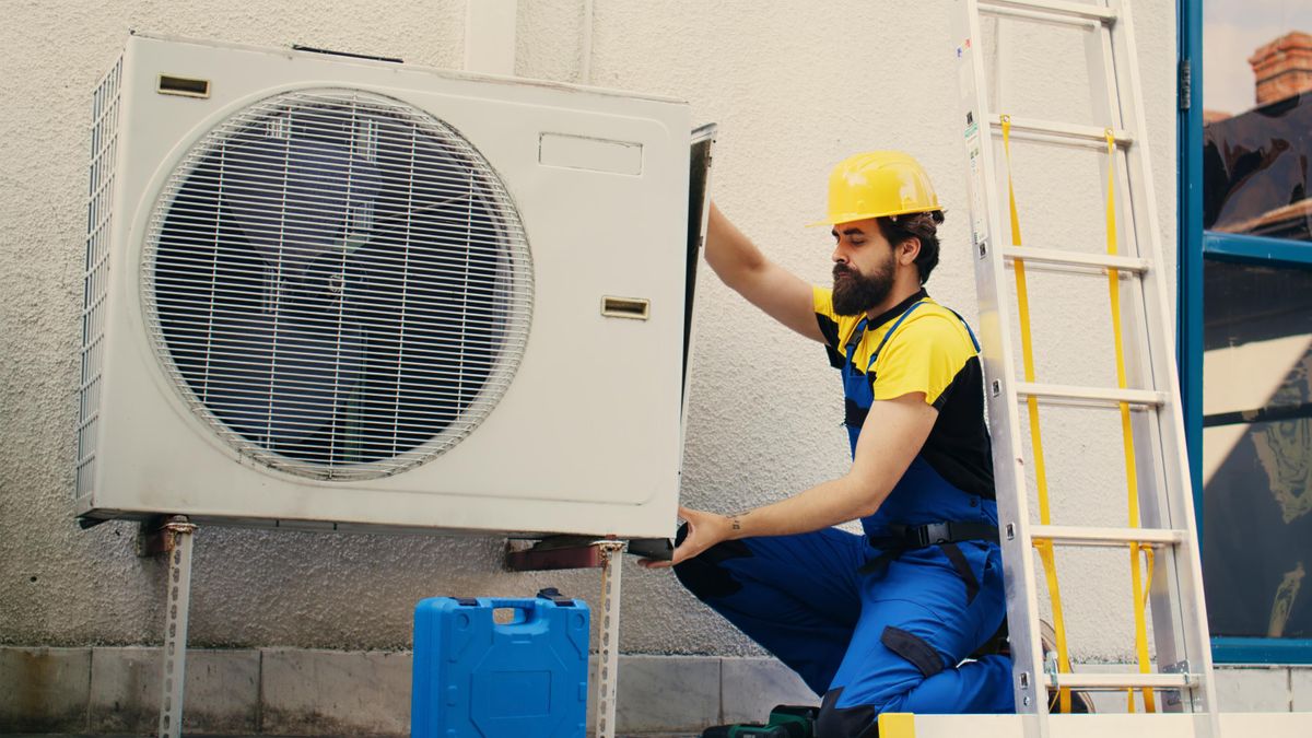 hvac specialist repairing ac hvac technician working