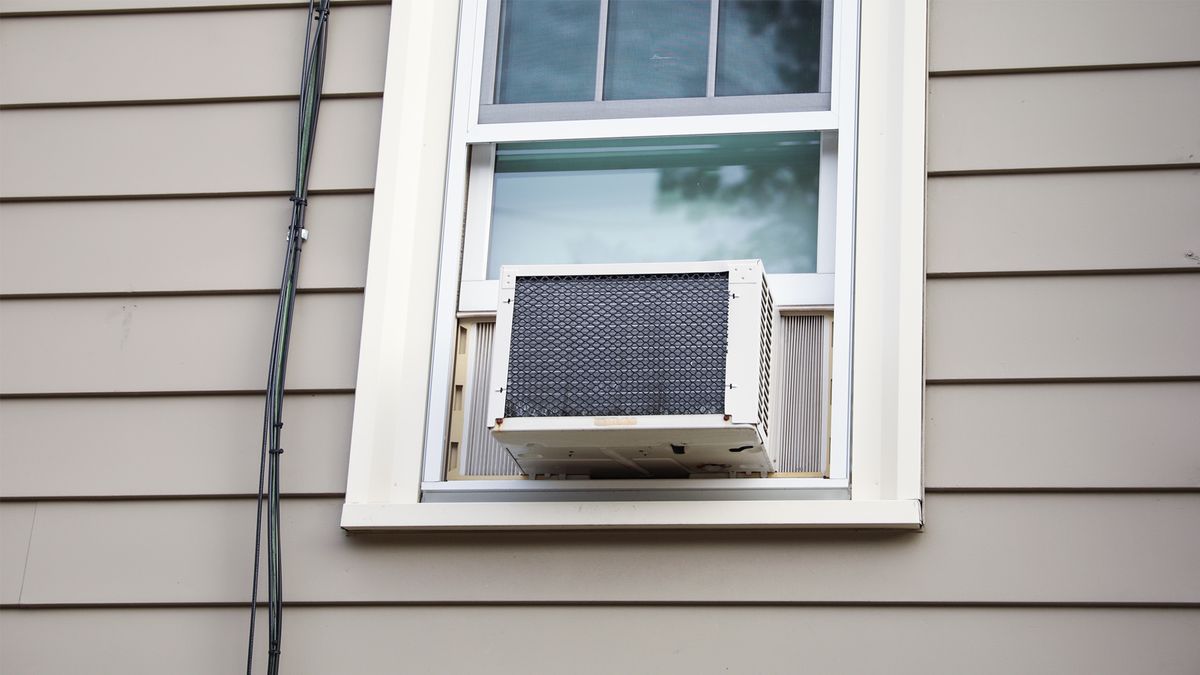Window air conditioner installed in a home's window