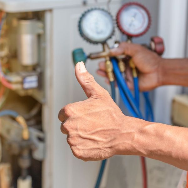 HVAC contractor gives thumbs up for AC test