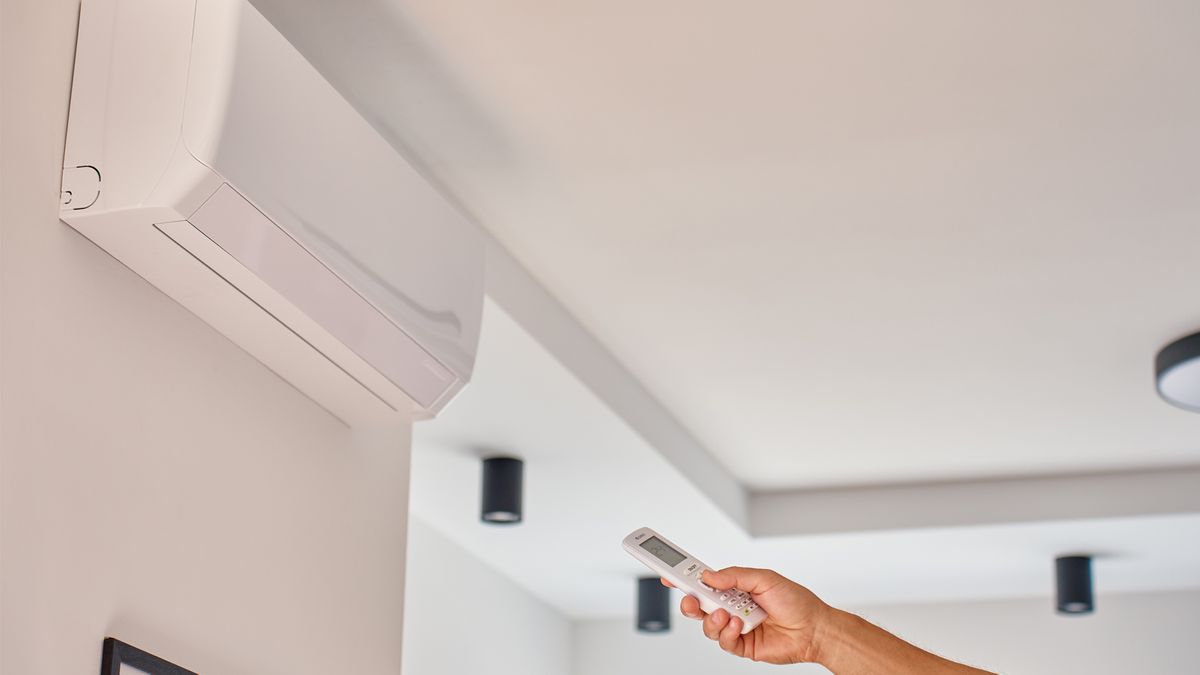 AC setup with wall-mounted air conditioner and remote control