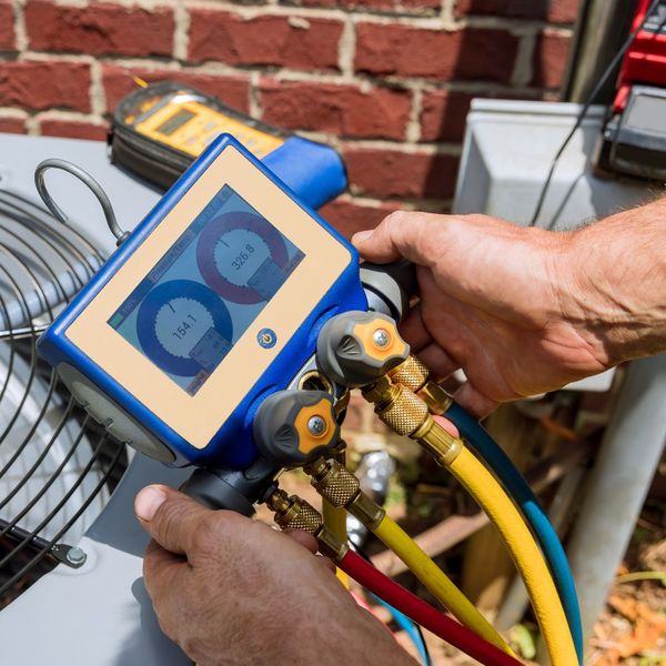 Person testing an AC unit.