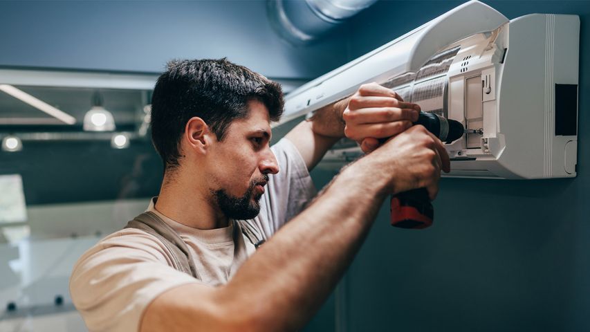 HVAC technician performing a professional AC tune-up in South Florida