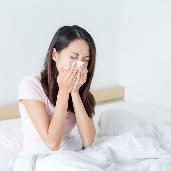 A women sneezing