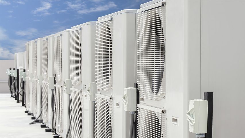 Row of LG Multi V VRF outdoor units installed on a rooftop for efficient climate control in Miami Beach condos and townhouses. LG Multi V VRF System Installation for Condos and Townhouses in Miami Beach