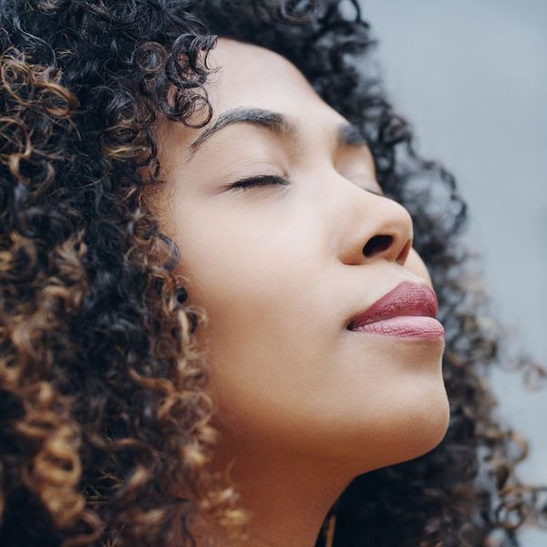 A women taking a deep breath