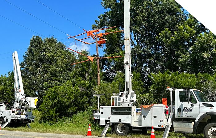 Powerline trucks working on line