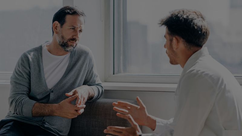 man consulting with doctor