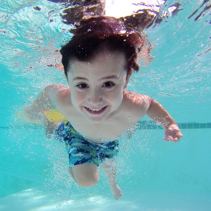 kid swimming in pool
