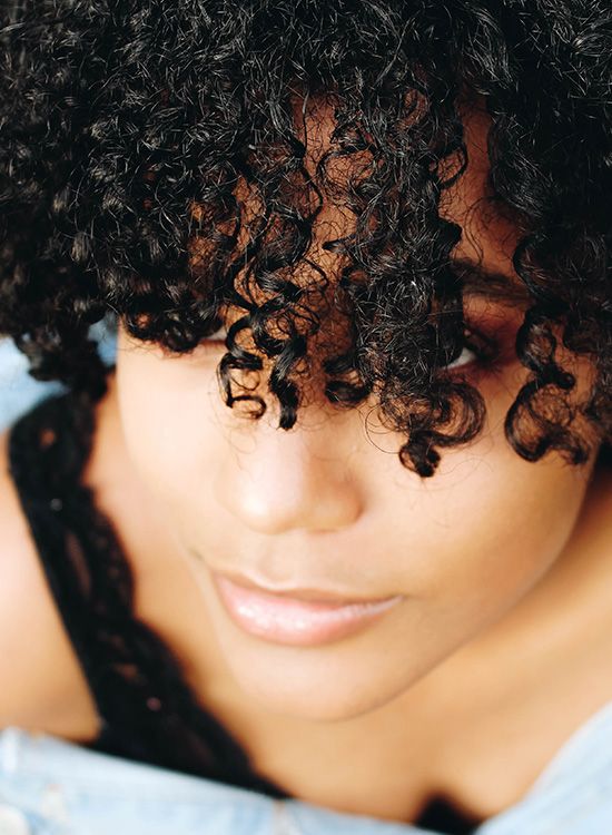 Woman with curly black hair