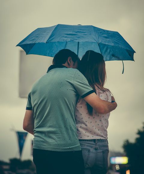 man-hugging-woman-while-holding-umbrella-1534633-5eb997b883083.jpg