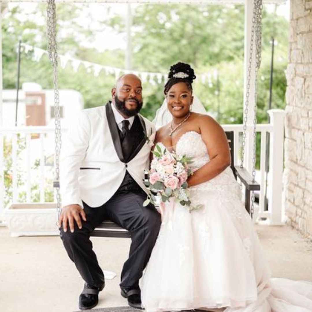 married couple sitting on swing