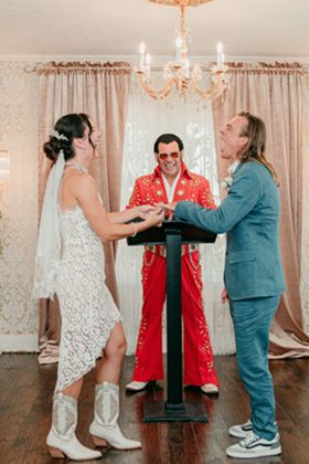 man and woman getting married by Elvis