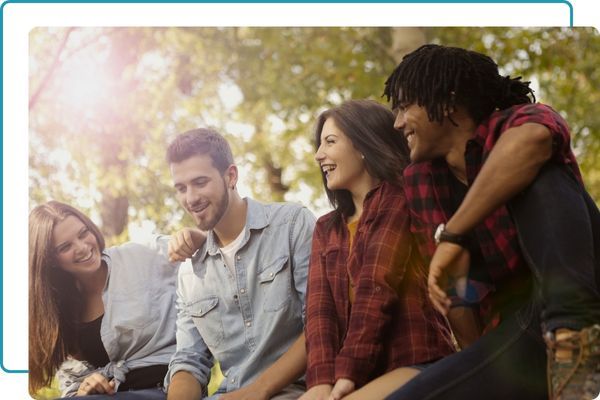 group of 4 adults enjoying outside