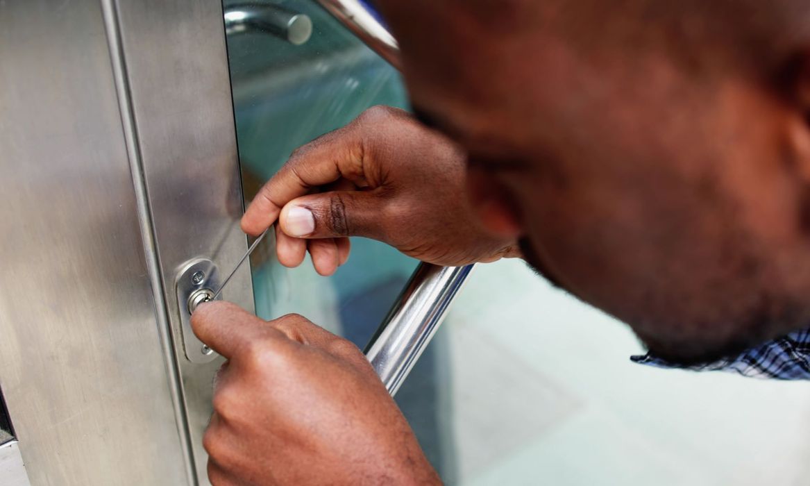 locksmith working on door lock