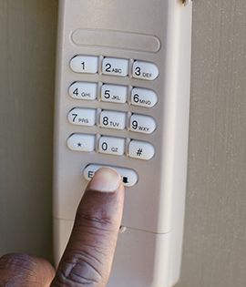A person pushing buttons on a key pad