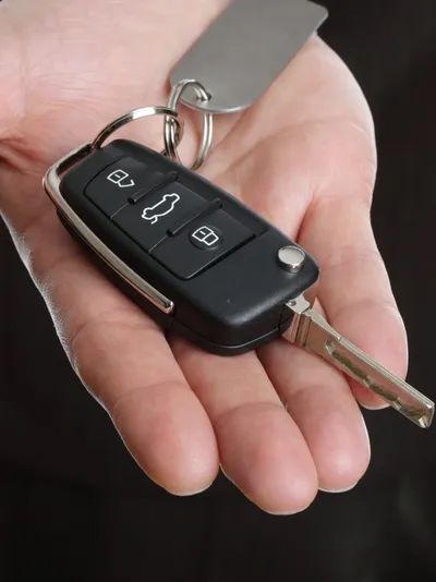 man holding a key fob