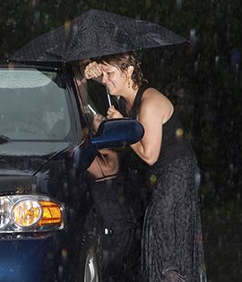 woman locked out of her car in the rain