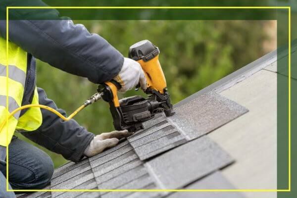roofer installing shingles