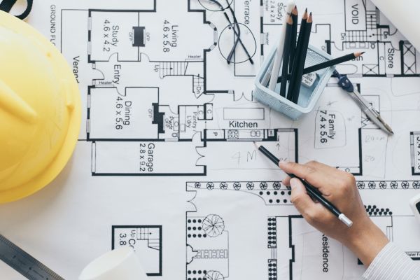 blue print with construction hat residential const.jpg