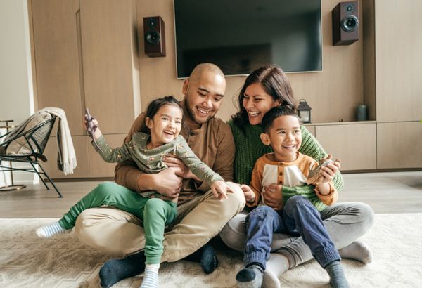 Happy young family in their home