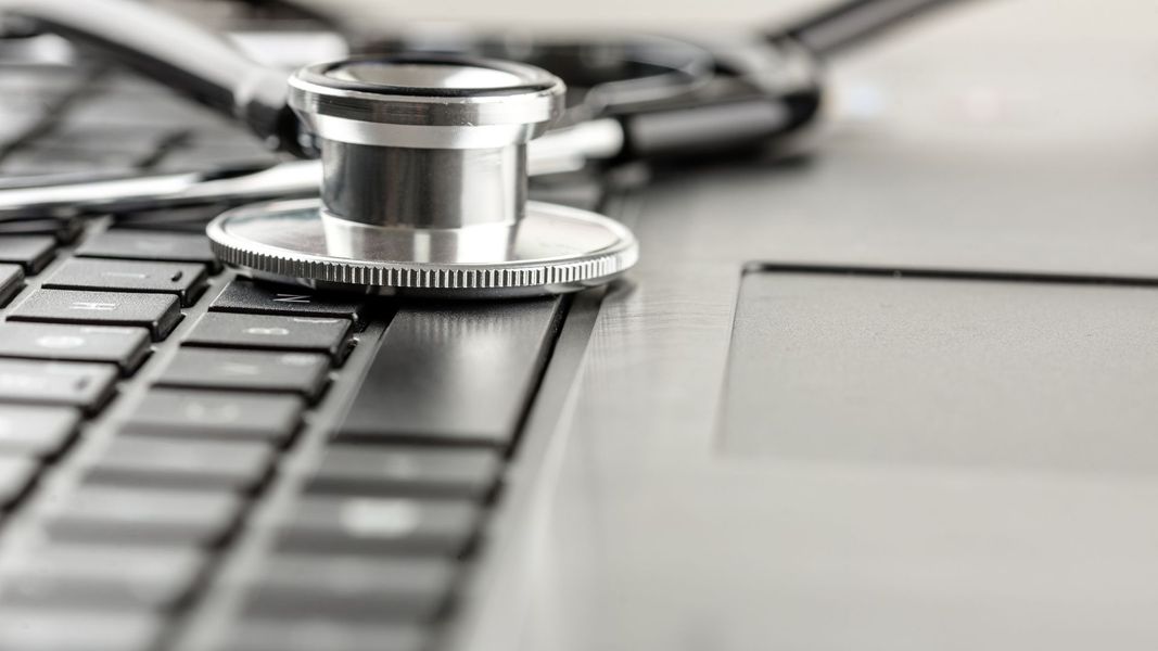 stethoscope on a laptop keyboard. 