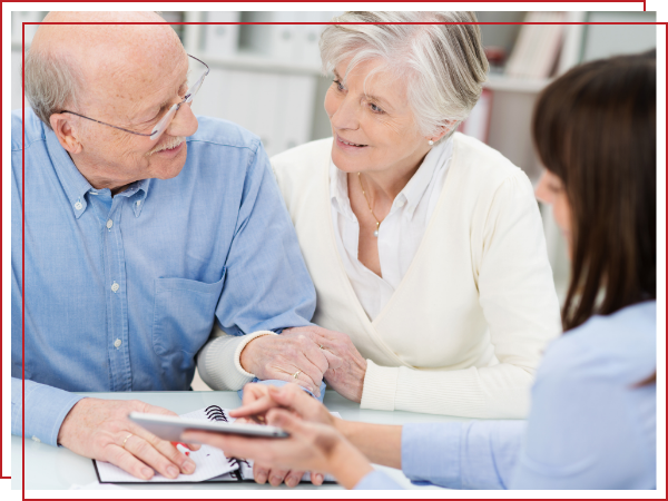 woman discussing documents with two seniors. 