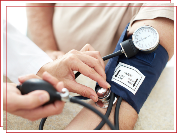 elderly person getting their blood pressure taken.