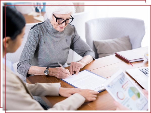 elderly woman filling out paperwork on a clipboard. 