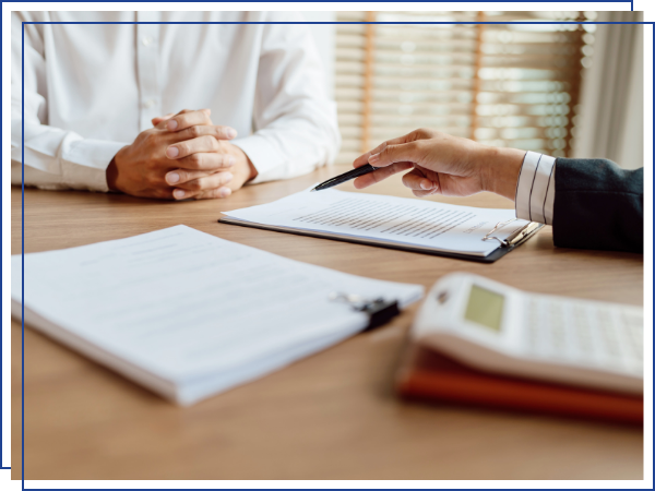 insurance agent discussing paperwork with a senior. 