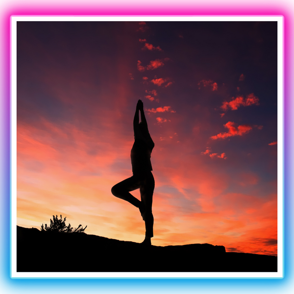 Doing yoga under the sunset